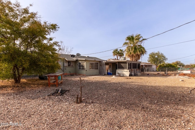 back of house featuring a sunroom