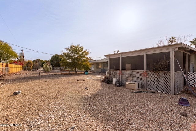 view of yard with a sunroom