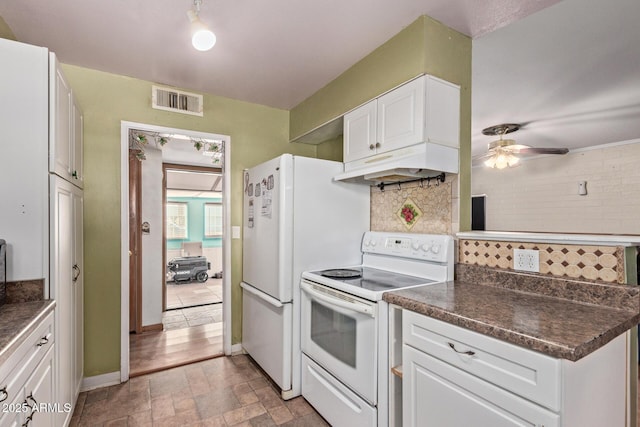 kitchen featuring white cabinetry, white electric range, and tasteful backsplash