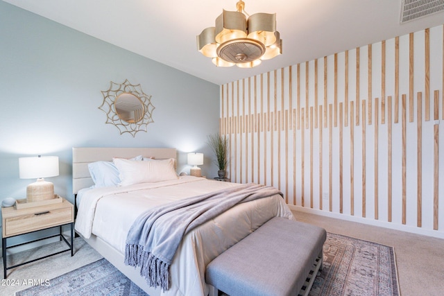 bedroom featuring ceiling fan and light carpet