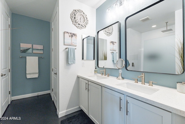 bathroom with vanity and walk in shower