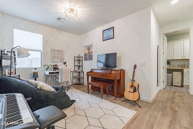 living room with light hardwood / wood-style floors