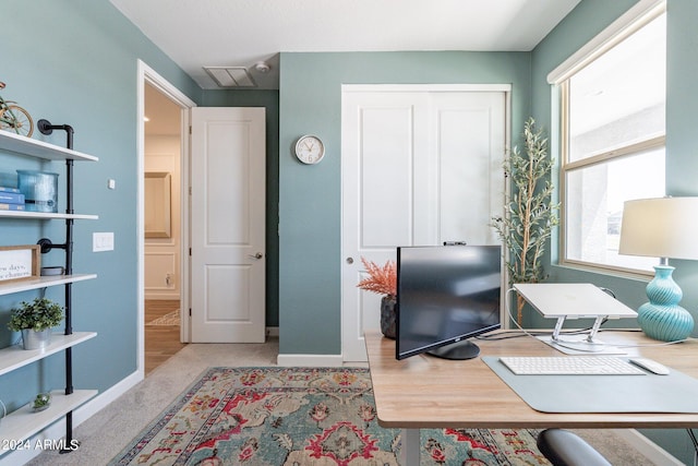 office with light hardwood / wood-style floors