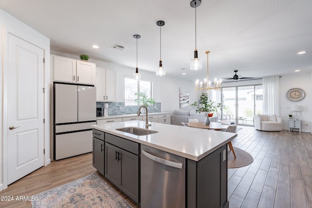 kitchen featuring sink, light hardwood / wood-style floors, high end white fridge, dishwasher, and white cabinetry