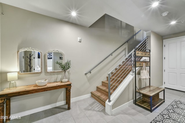 staircase featuring tile patterned floors, recessed lighting, and baseboards