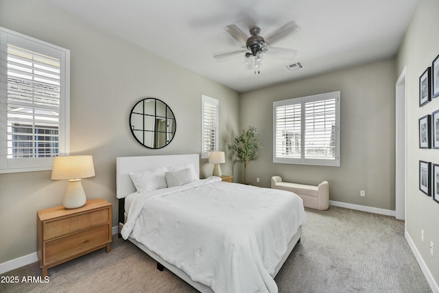 bedroom featuring visible vents, ceiling fan, carpet, and baseboards