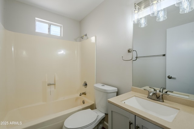 full bathroom featuring washtub / shower combination, vanity, and toilet