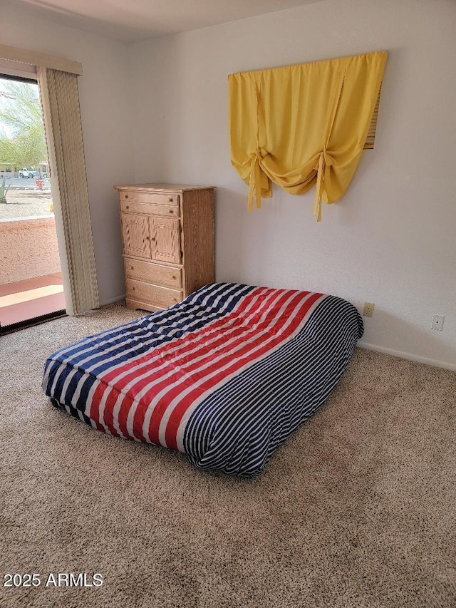 311 E Lancaster Ct, Florence, AZ 85132 - carpeted bedroom featuring baseboards and access to outside