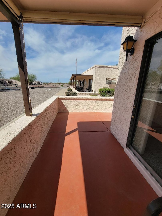311 E Lancaster Ct, Florence, AZ 85132 - view of patio featuring a balcony