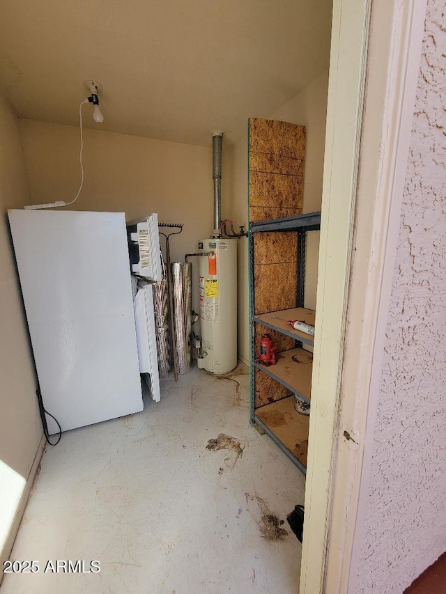 311 E Lancaster Ct, Florence, AZ 85132 - basement featuring water heater and freestanding refrigerator