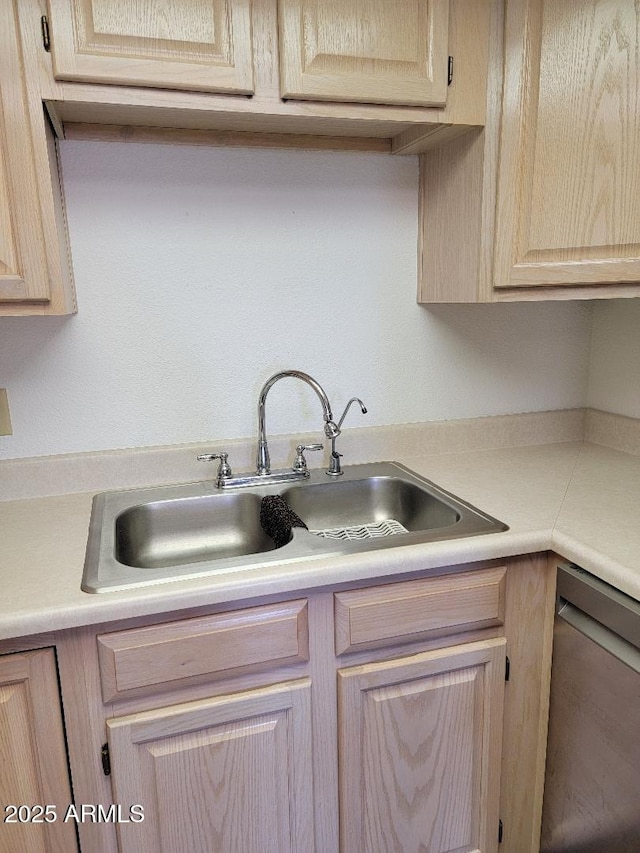 311 E Lancaster Ct, Florence, AZ 85132 - kitchen featuring light brown cabinets, stainless steel dishwasher, light countertops, and a sink
