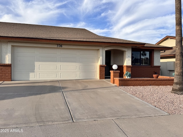 8161 E Keats Ave Unit 376, Mesa, AZ 85209 - ranch-style home featuring concrete driveway, a garage, brick siding, and roof with shingles
