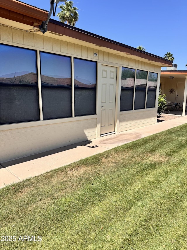 8161 E Keats Ave Unit 376, Mesa, AZ 85209 - view of exterior entry featuring a lawn
