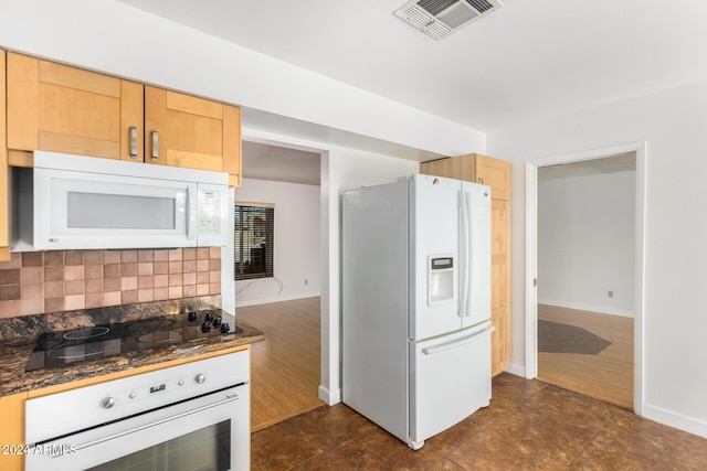 kitchen featuring light brown cabinetry, backsplash, white appliances, and dark hardwood / wood-style floors