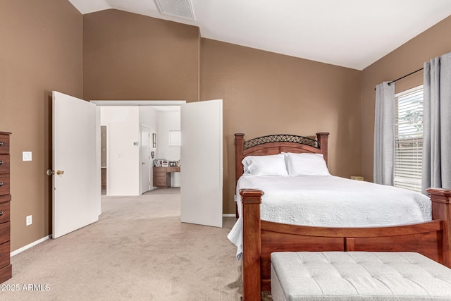 bedroom with visible vents, high vaulted ceiling, and light colored carpet