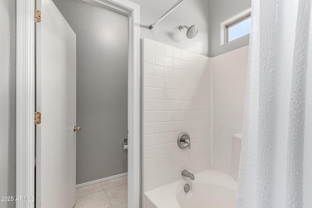 bathroom featuring tile patterned flooring and shower / bathtub combination with curtain