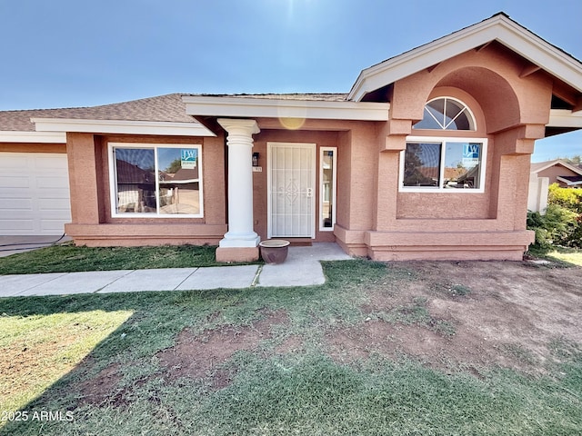 915 E Annette Dr, Phoenix, AZ 85022 - view of front facade featuring a garage, a front lawn, stucco siding, and roof with shingles