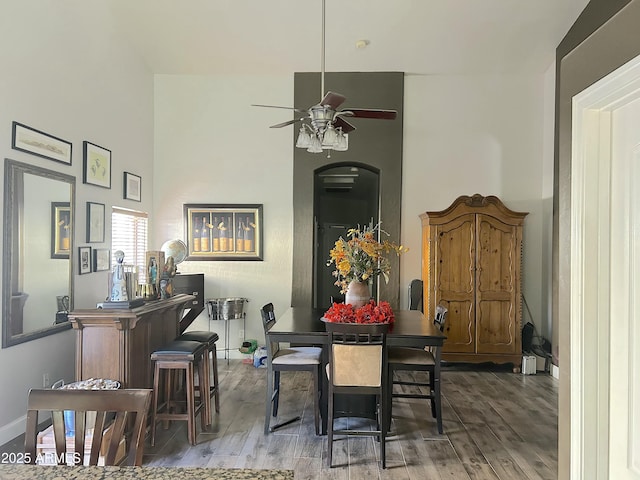 dining area featuring hardwood / wood-style floors and ceiling fan