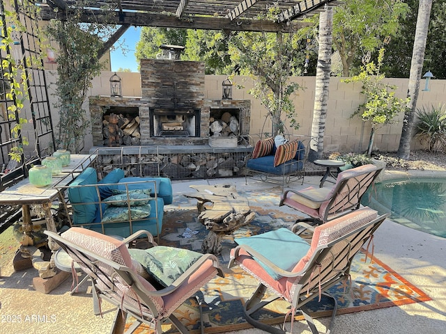 view of patio with a fenced in pool, a pergola, and an outdoor stone fireplace