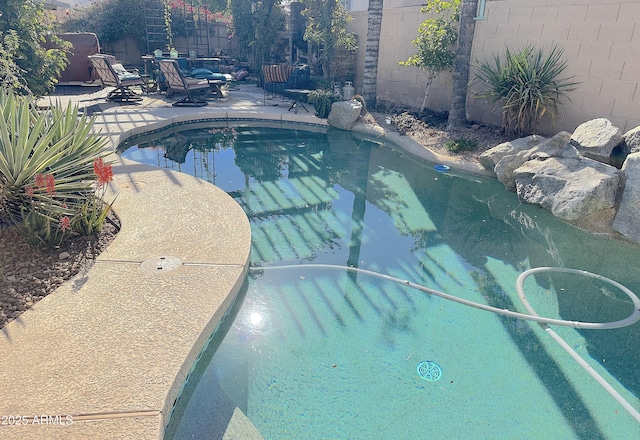 view of pool featuring a patio