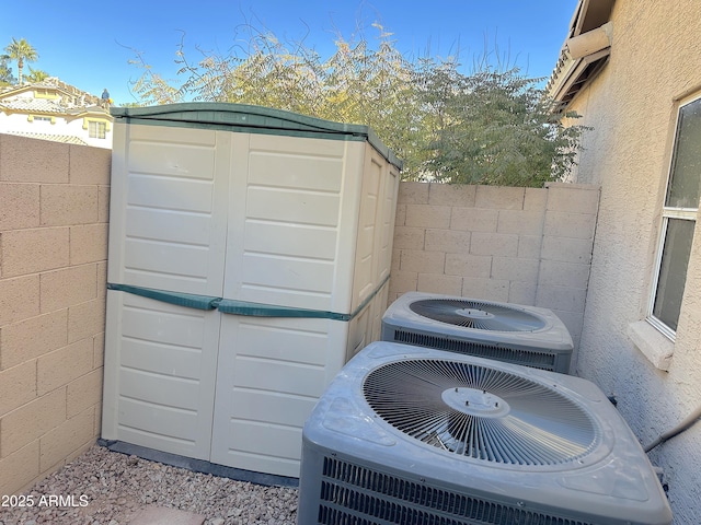 exterior space featuring central AC and a storage unit