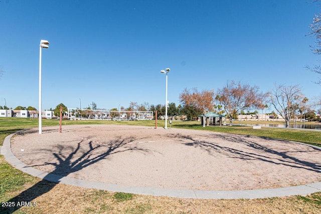 view of property's community featuring a yard, a gazebo, and volleyball court