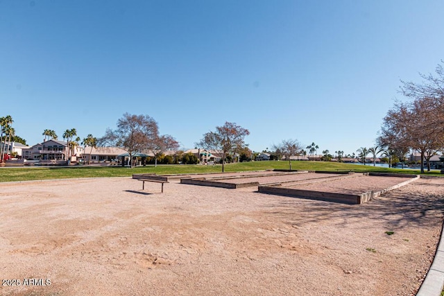 view of home's community with a yard