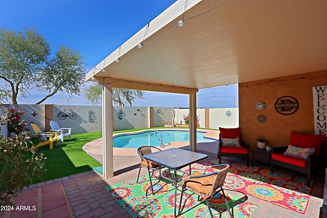 view of swimming pool featuring a patio area and a lawn