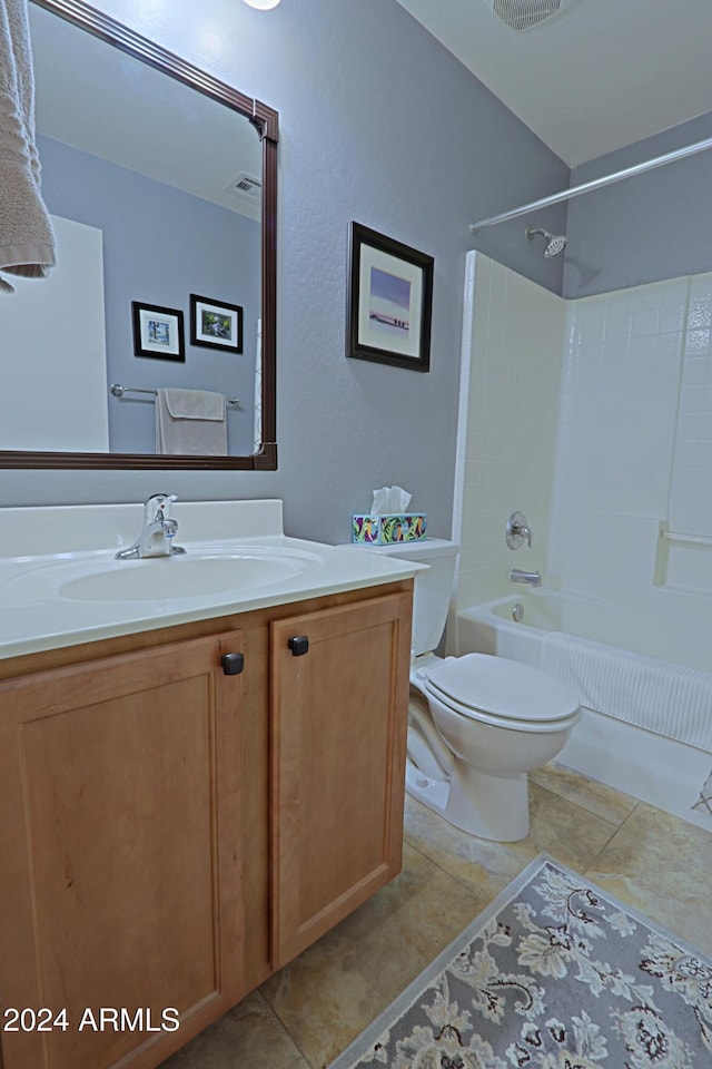 full bathroom featuring vanity, tile patterned flooring, toilet, and shower / washtub combination