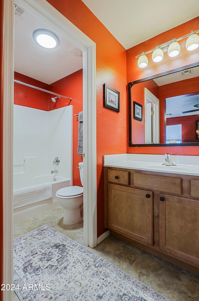 full bathroom with toilet, vanity, and shower / bathtub combination