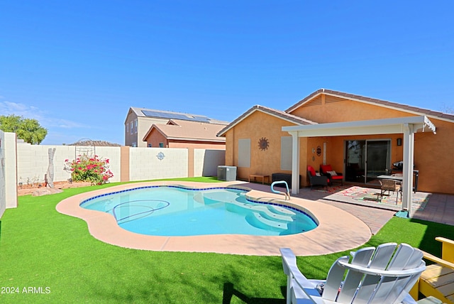 view of pool with a patio, a lawn, and central air condition unit