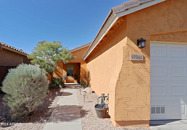 property entrance featuring a garage