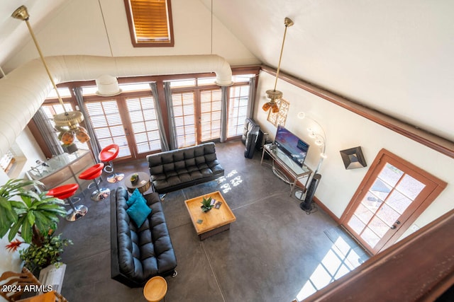 living room featuring high vaulted ceiling