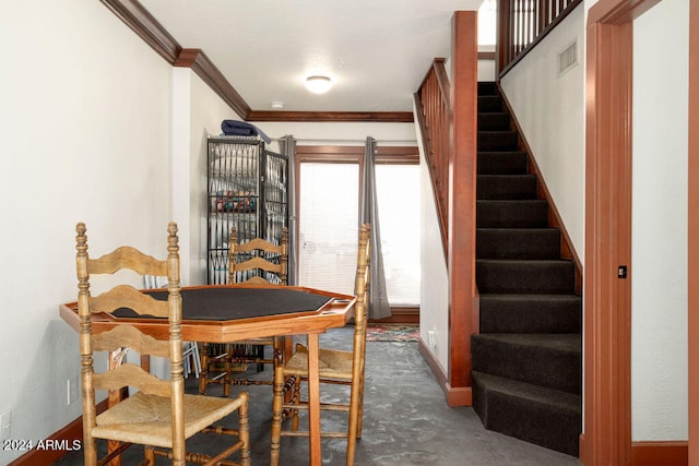 dining space featuring ornamental molding