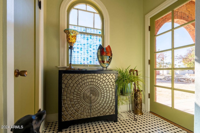 doorway to outside featuring plenty of natural light