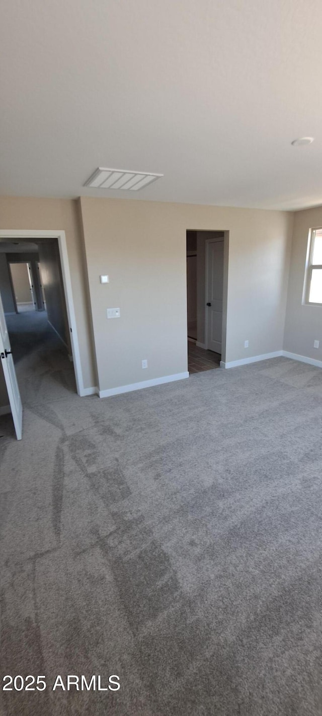 15587 S 180th Ln, Goodyear, AZ 85338 - empty room with carpet flooring and baseboards