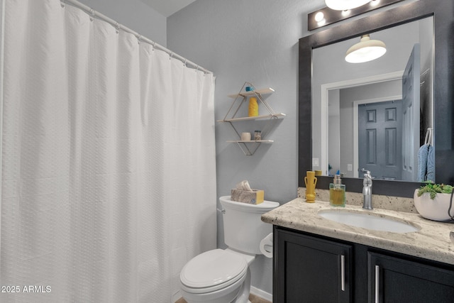 full bathroom featuring toilet and vanity