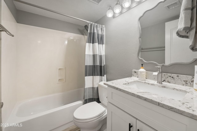 full bath featuring toilet, shower / bath combination with curtain, and vanity