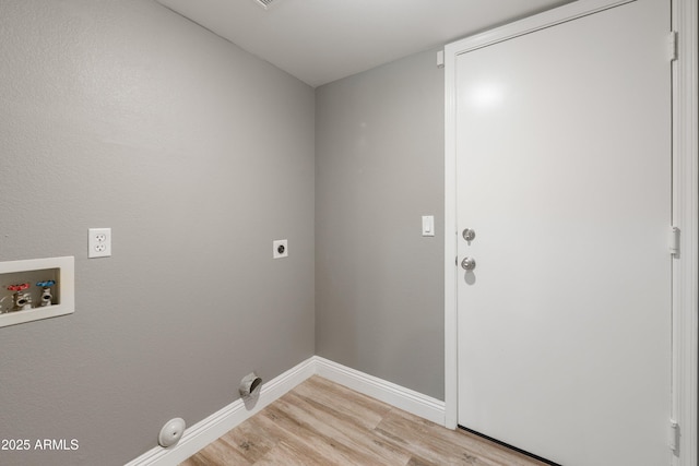 washroom with washer hookup, electric dryer hookup, light wood-type flooring, and baseboards
