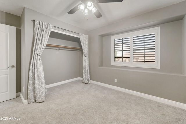 unfurnished bedroom featuring carpet flooring, a closet, and baseboards