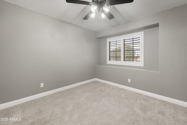 unfurnished room featuring carpet floors, ceiling fan, and baseboards