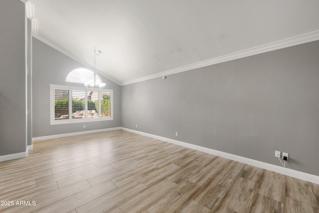 unfurnished room with a chandelier, light wood-style floors, baseboards, lofted ceiling, and crown molding