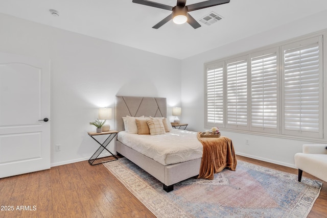 bedroom with hardwood / wood-style flooring and ceiling fan