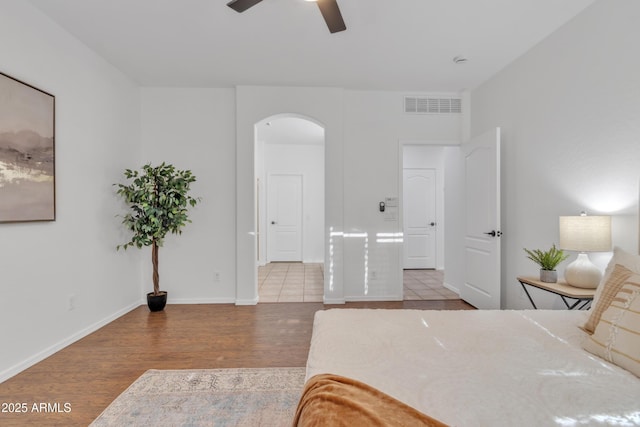 bedroom featuring ceiling fan and hardwood / wood-style flooring