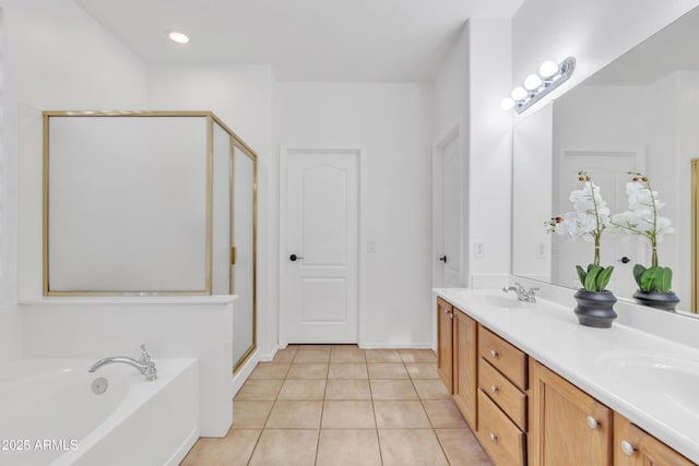 bathroom with tile patterned flooring, plus walk in shower, and vanity