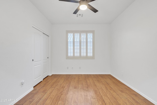 unfurnished bedroom with a closet, ceiling fan, and light hardwood / wood-style flooring