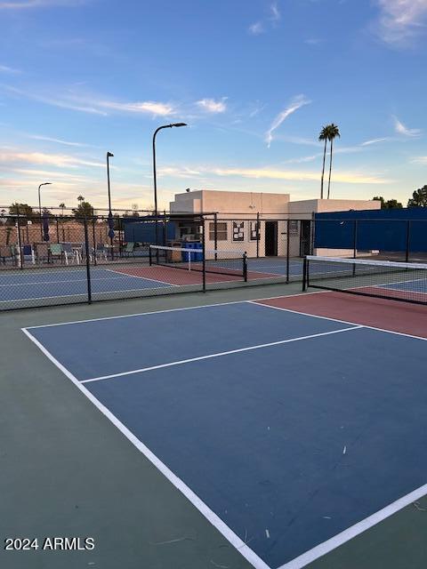 view of sport court featuring basketball hoop