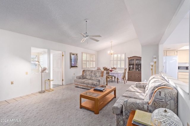 carpeted living room with ceiling fan with notable chandelier, lofted ceiling, and a textured ceiling