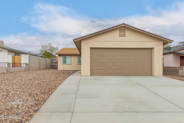 9105 N 13th St, Phoenix, AZ 85020 - view of front of home featuring concrete driveway, fence, and a garage