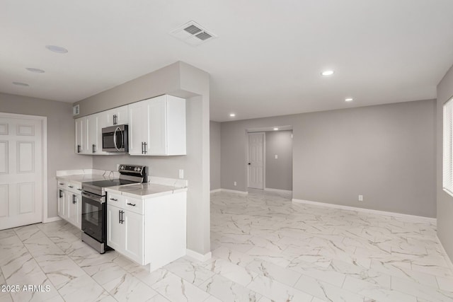 9105 N 13th St, Phoenix, AZ 85020 - kitchen with visible vents, baseboards, light countertops, appliances with stainless steel finishes, and marble finish floor